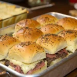 Roast Beef Sliders with melted cheese on Hawaiian rolls