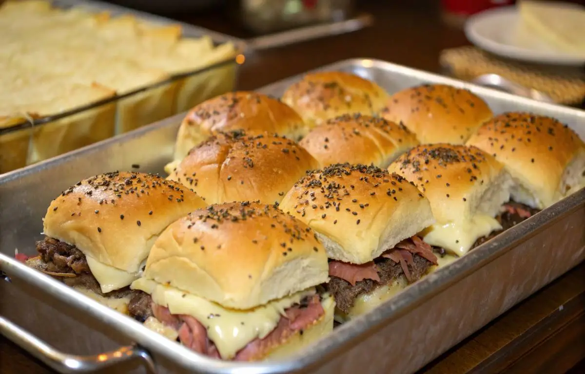 Roast Beef Sliders with melted cheese on Hawaiian rolls