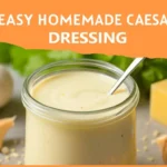 Creamy easy homemade Caesar dressing in a glass jar with salad on the side